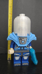 Mr. Freeze brick megafig standing next to a yellow measuring tape to display its height scale
