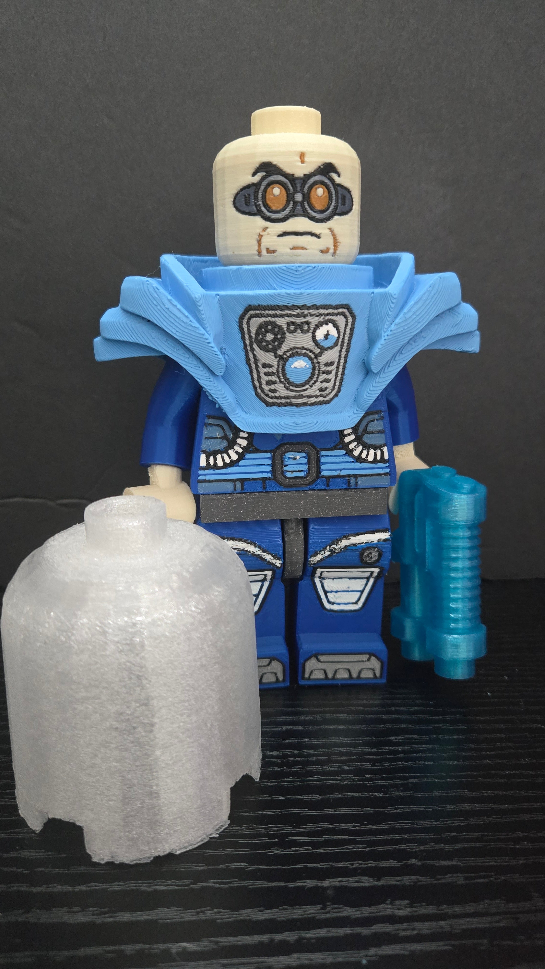Mr. Freeze megafig displayed with the translucent dome helmet removed next to the figure