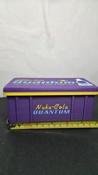 A horizontal yellow measuring tape placed across the closed storage box to display its exact physical width