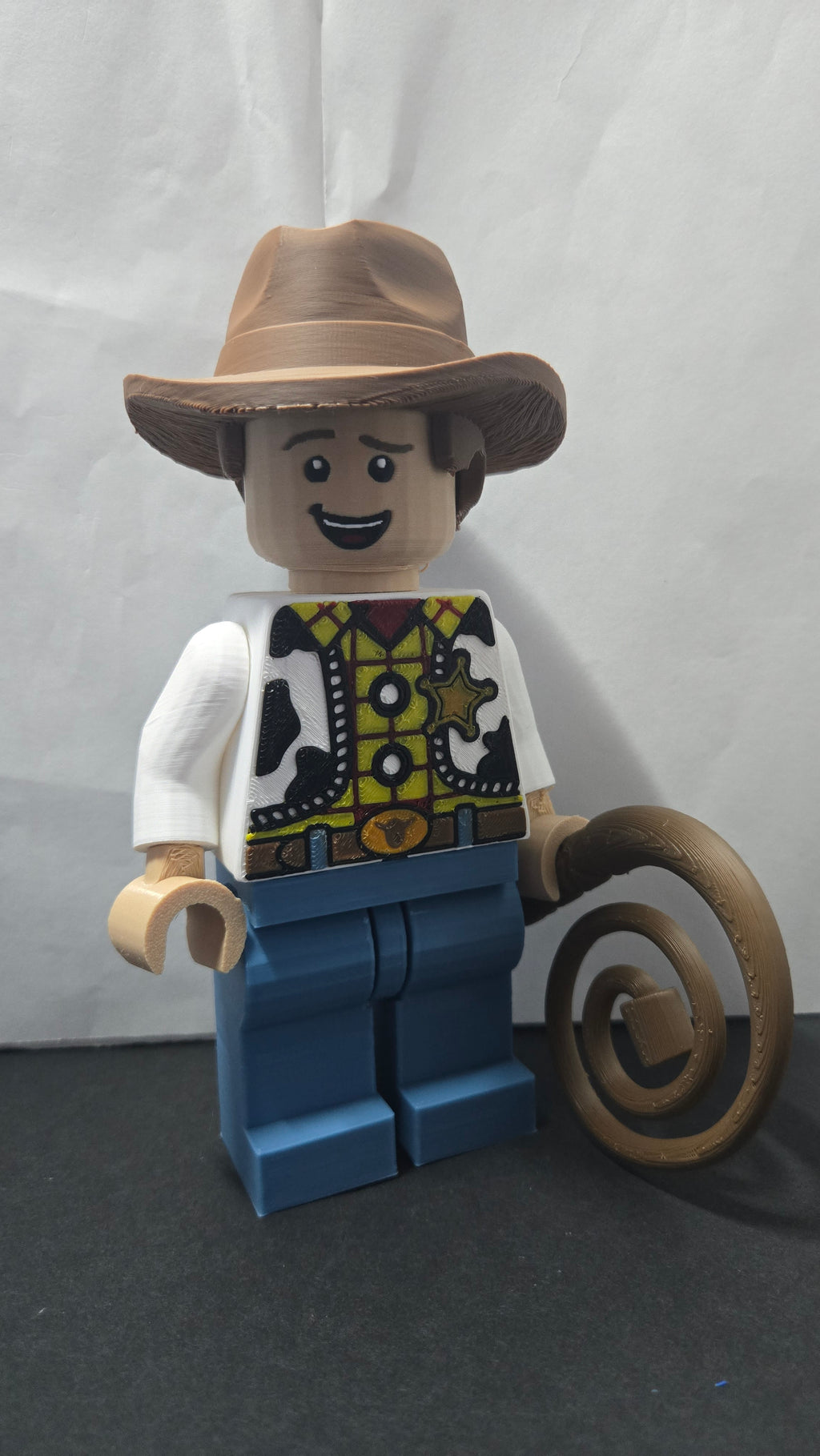 Three-quarter view of the oversized cowboy sheriff brick megafig holding his lasso