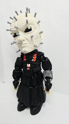 Three-quarter left profile view of the 3D printed Pinhead figurine highlighting the clean multi-color print transitions