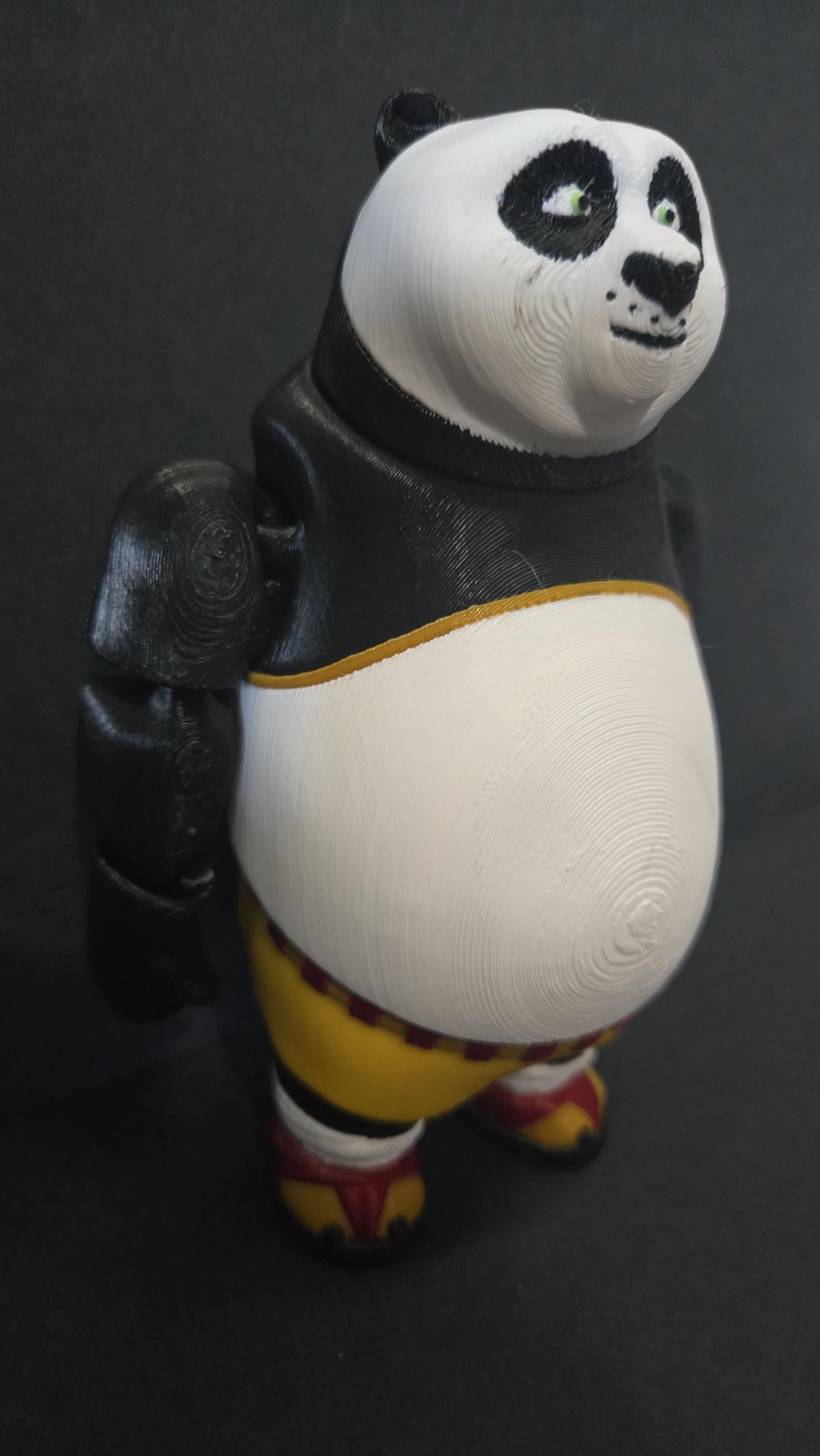 Right side view of the jointed Po figure slightly flexed to demonstrate the dynamic movement of the leg and arm segments