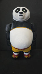 Straight front facing view focusing on the detailed panda face, bright eyes, and martial arts shorts of the flexible Po figure