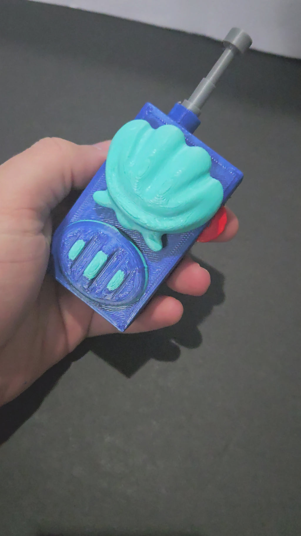 A demonstration video of the 3D printed underwater cartoon walkie-talkie prop showing the functional clicker mechanism in action