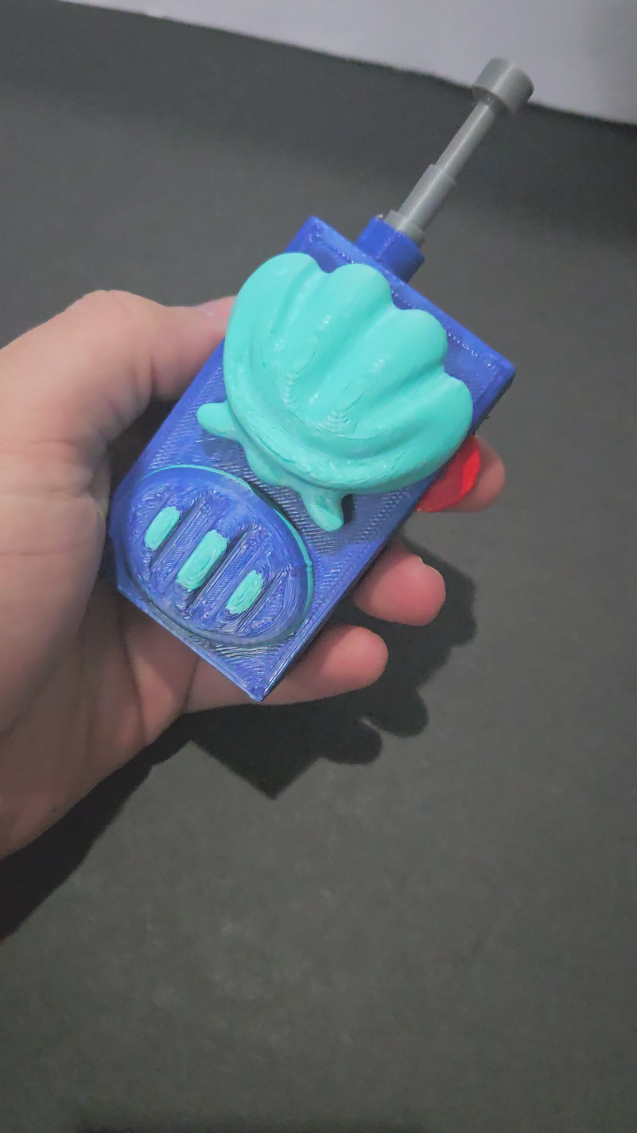 A demonstration video of the 3D printed underwater cartoon walkie-talkie prop showing the functional clicker mechanism in action