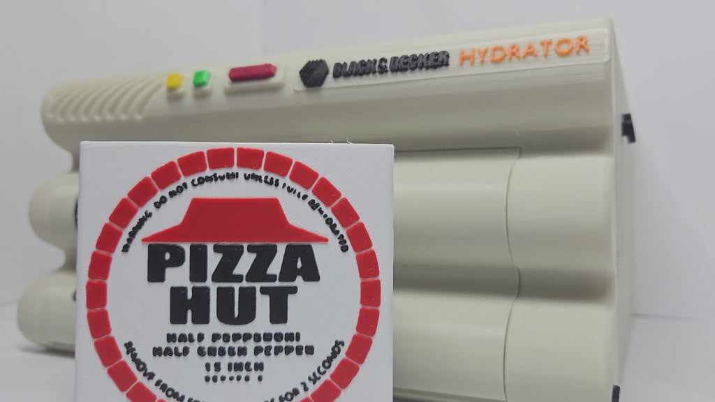 A demonstration video of the functional 3D printed Back to the Future hydrator prop showing the manual mechanical slide revealing the expanded pepperoni pizza