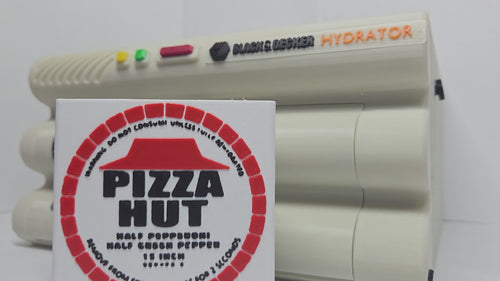 A demonstration video of the functional 3D printed Back to the Future hydrator prop showing the manual mechanical slide revealing the expanded pepperoni pizza