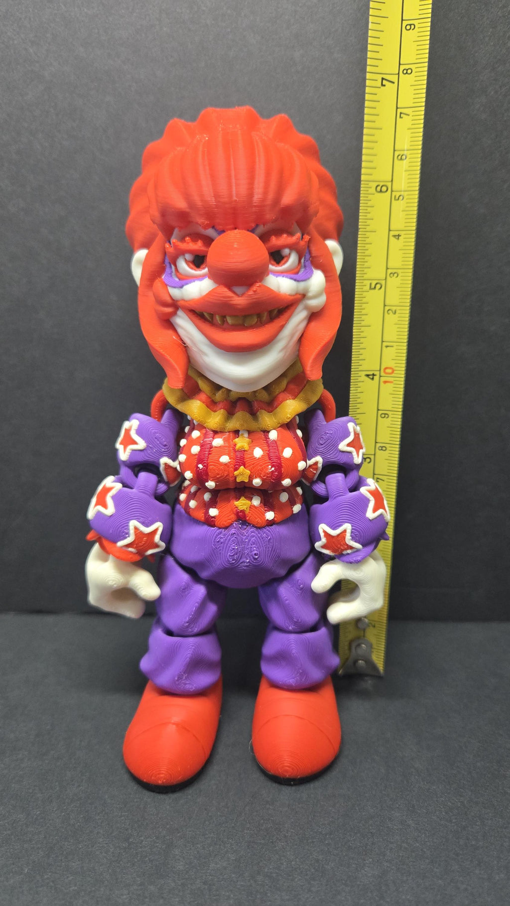 Yellow measuring tape showing the 7-inch height of the 3D printed Rosebud flexi figure