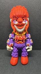 Straight front view of the 3D printed Rosebud flexi figure showing his orange hair and patterned clown suit