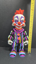 Yellow measuring tape showing the 8-inch height of the 3D printed Rudy flexi figure