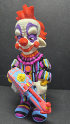 Left side profile view of the 3D printed Rudy flexi figure showing articulation and popcorn gun detail