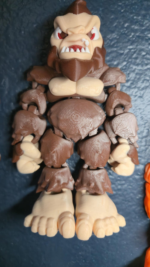 Straight front-on shot focusing on the detailed face, textured fur, and massive frame of the flexible Bigfoot figure