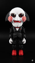 Full-color 3D printed Billy the Puppet flexi figure from Saw standing upright on a flat surface showing a complete front view