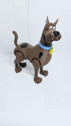 Left side profile view of the 3D printed Scooby-Doo figurine showcasing his poseable joints and tail