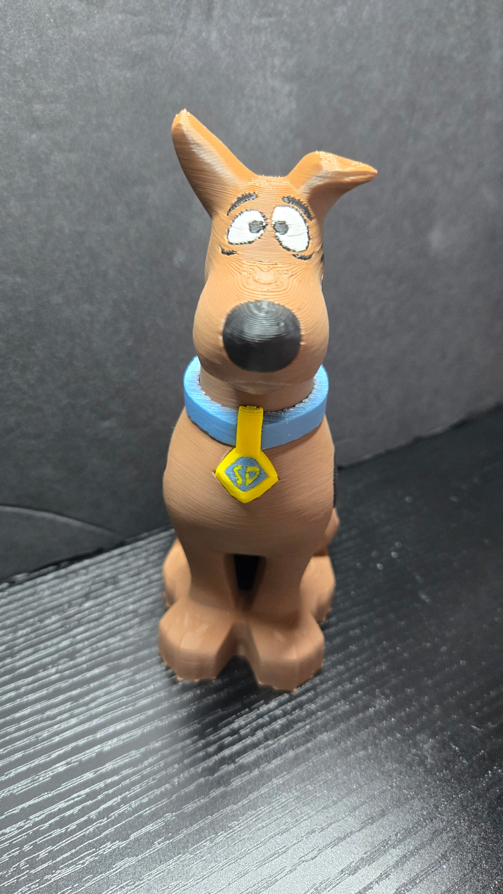 Straight front view of the Scooby-Doo brick megafig showing its blue collar and tag