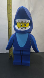 Measuring tape showing the towering height of the scaled oversized Shark Suit megafig