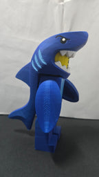 Right side profile view of the oversized Shark Suit megafig highlighting the dorsal fin and tail