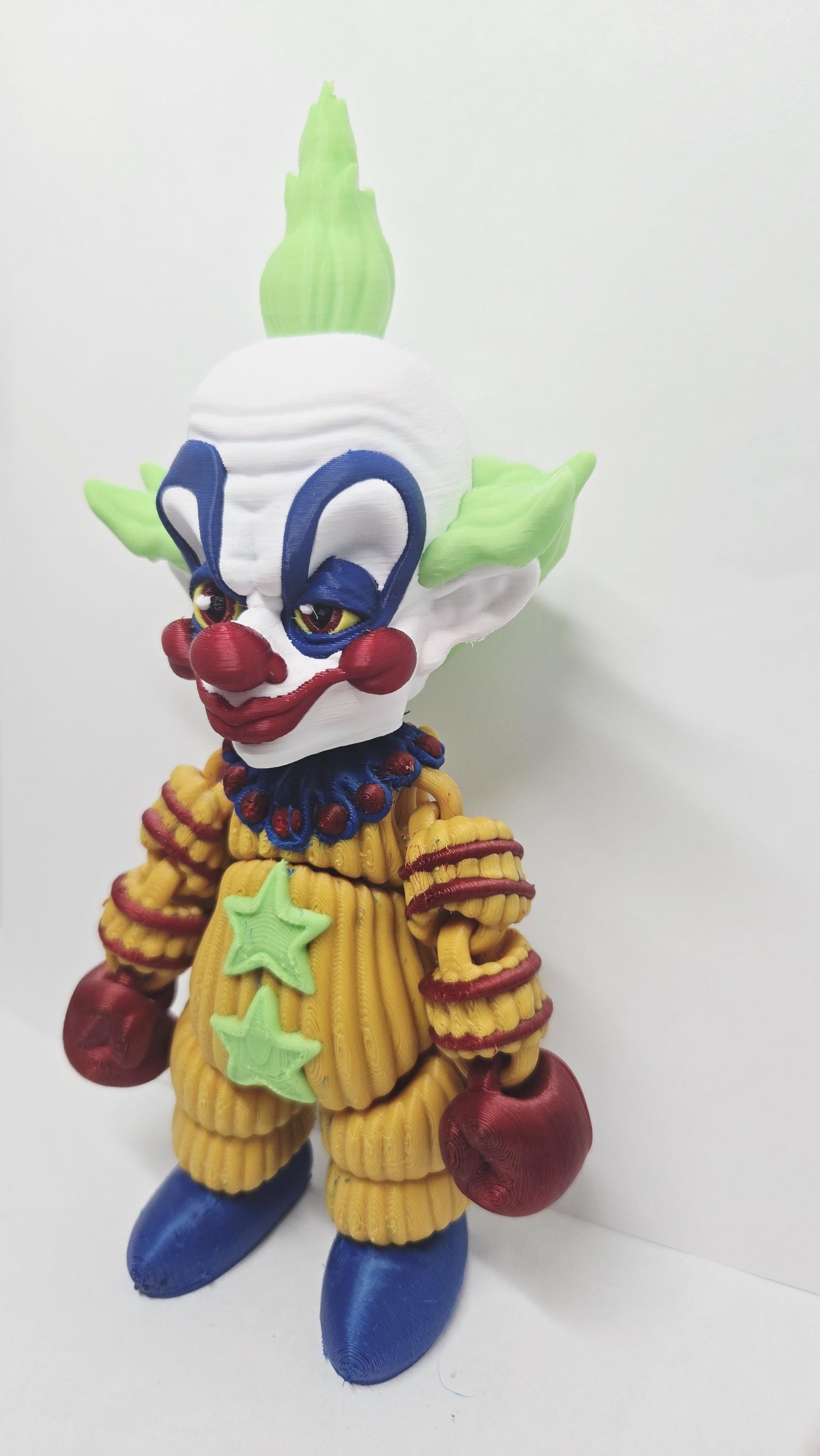 Three-quarter view of the Shorty flexi figure highlighting his poseable limbs and jointed segments