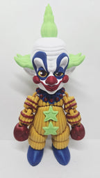 Straight front view of the 3D printed Shorty flexi figure showing his green hair and patterned clown suit