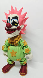 Left side profile view of the flexible Spikey toy demonstrating the multi-layer color layout and arm articulation