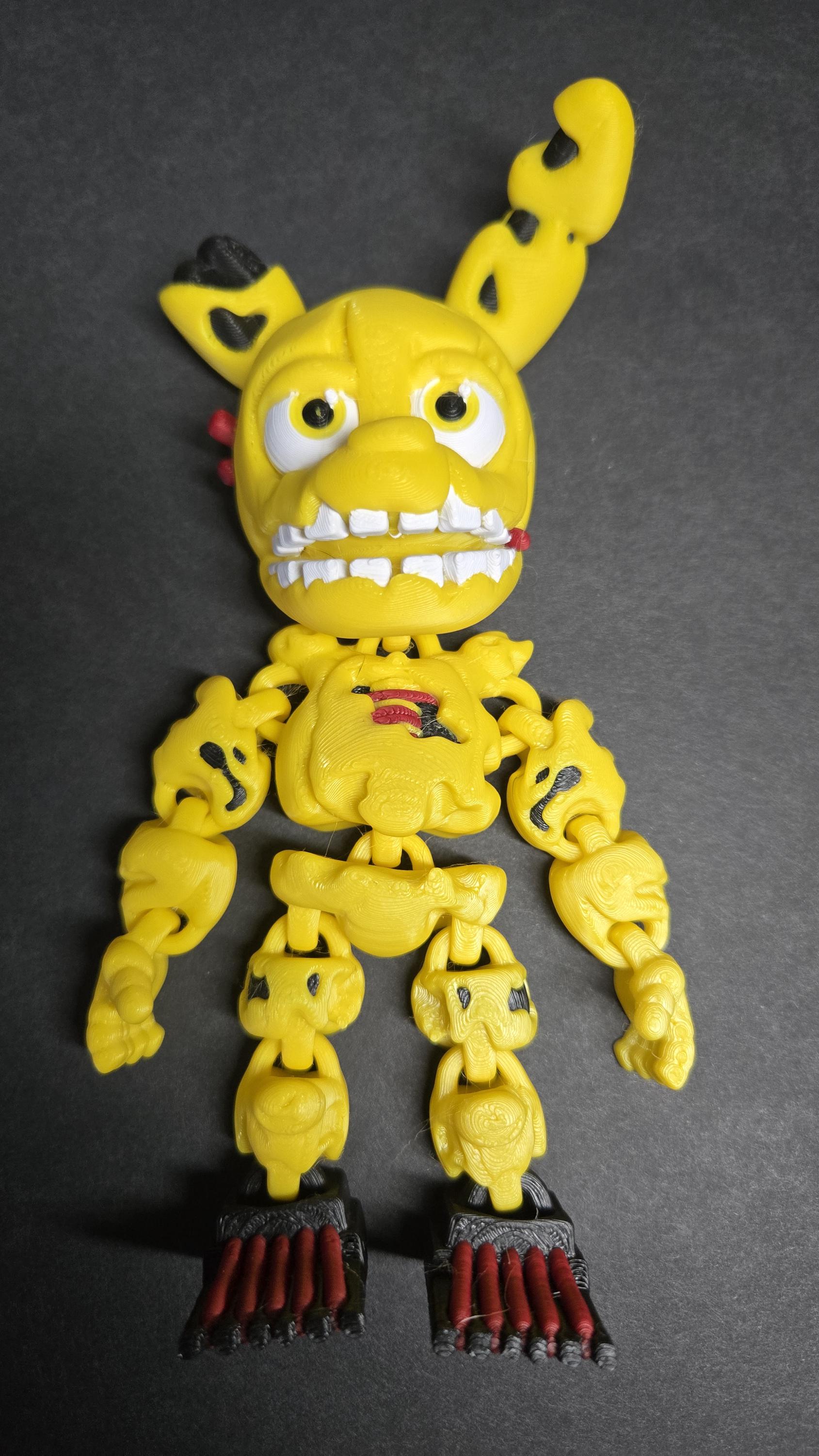 Straight front view of the articulated Spring Trap Bonnie flexi figure showing the detailed rabbit suit and animatronic frame
