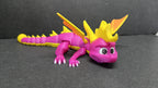 Side profile view of the flexible Spyro figure showcasing the horn detail, wing shape, and limb joints