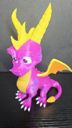 Three-quarter view of the Spyro figure highlighting his heroic expression and vibrant purple-and-yellow color scheme