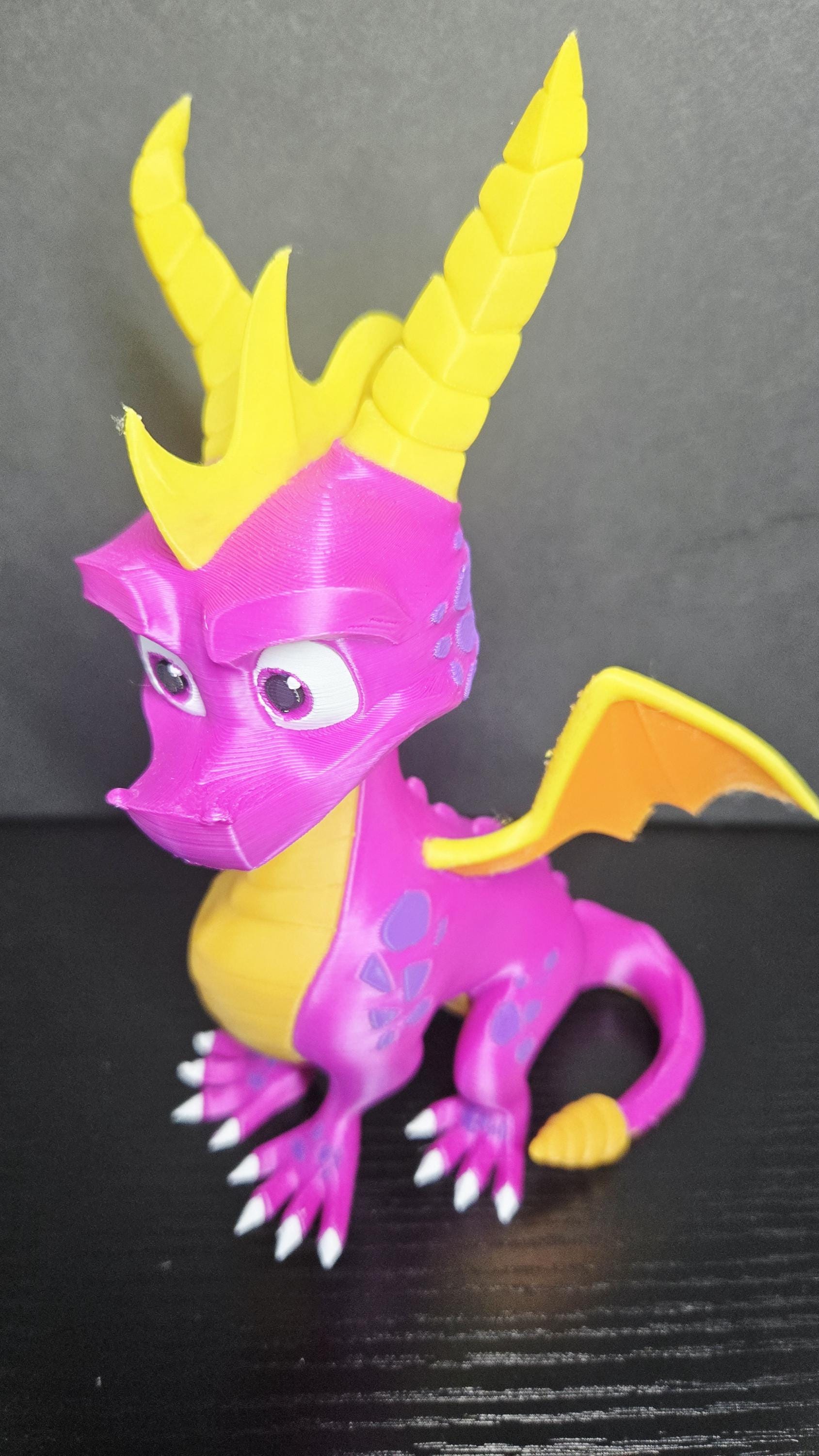 Three-quarter view of the Spyro figure highlighting his heroic expression and vibrant purple-and-yellow color scheme