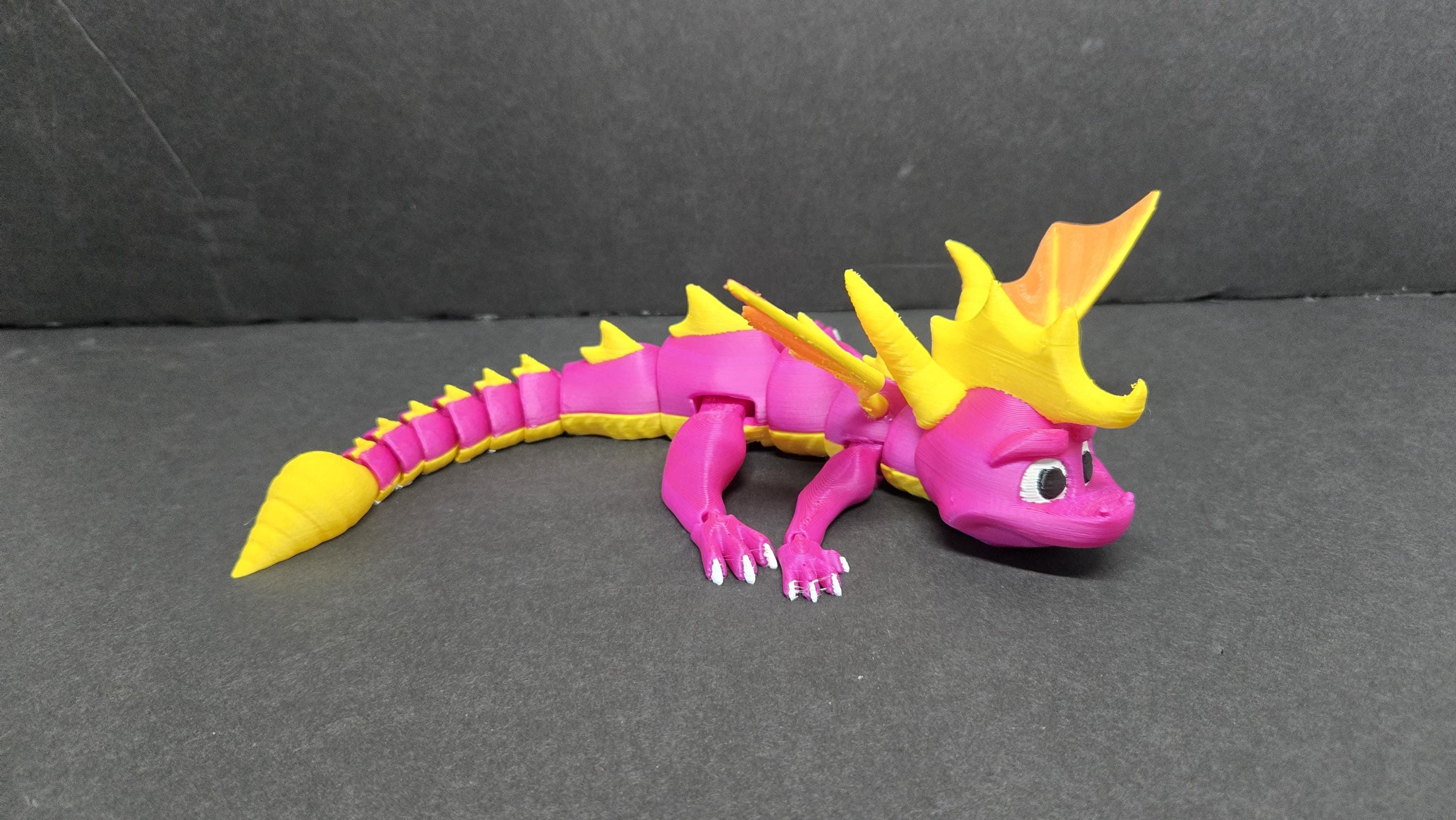 Spyro flexi figure posed in a curved, dynamic shape to demonstrate his flexible joint segments
