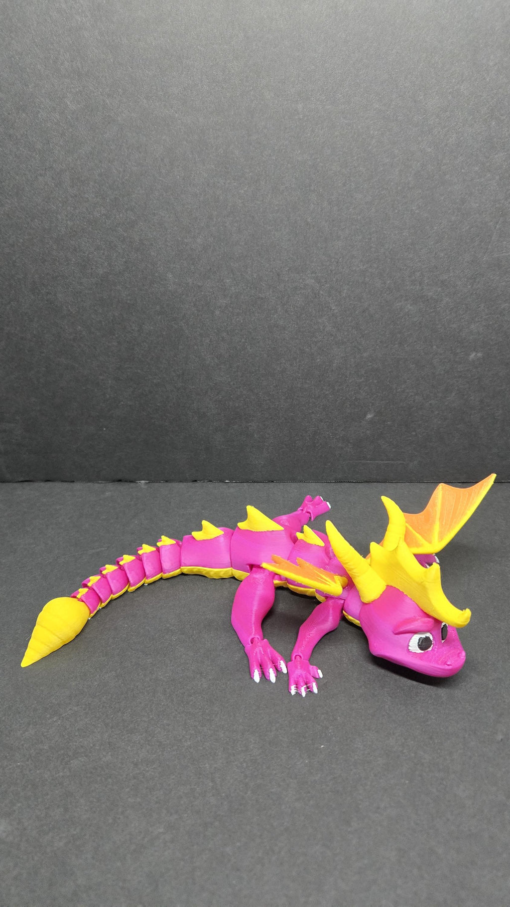 Top-down view of the flexible Spyro figure demonstrating the tail articulation and wing placement