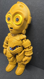 Three-quarter left profile view of the 3D printed C-3PO figurine highlighting the clean multi-color print transitions on the face and torso