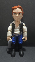 Full-color 3D printed Star Wars Han Solo flexi figure standing upright on a flat surface holding his DL-44 blaster as the main product view