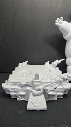Close-up of the unpainted 3D printed city street base showing rubble and architectural street-level details of the diorama