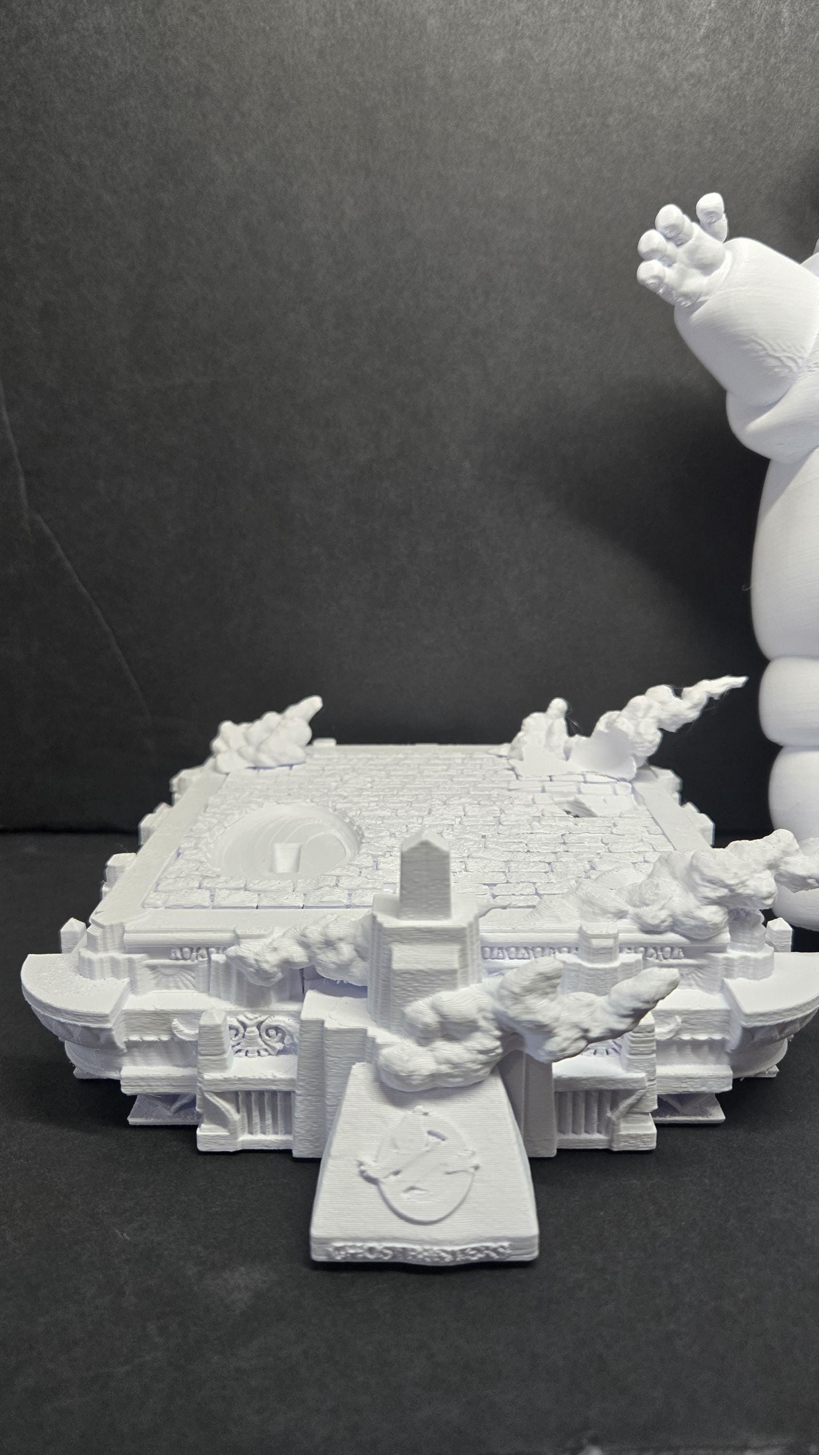 Close-up of the unpainted 3D printed city street base showing rubble and architectural street-level details of the diorama