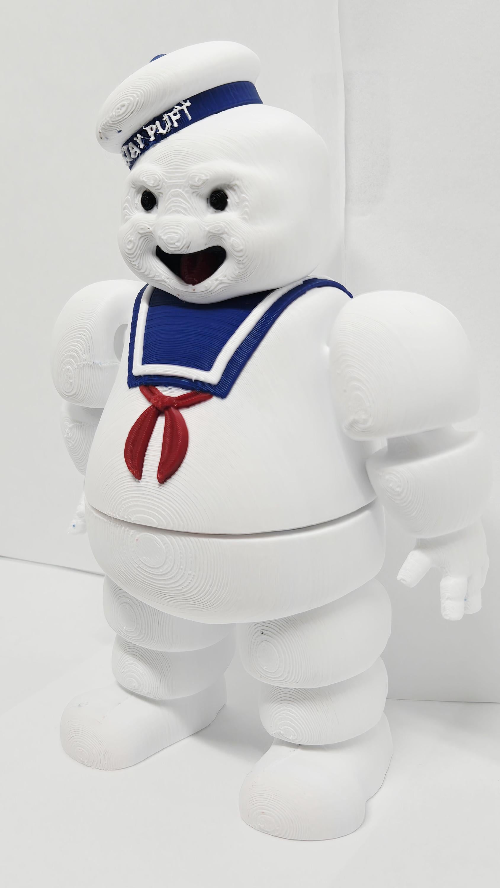 Three-quarter left profile view of the 3D printed Stay Puft figurine highlighting the clean multi-color print transitions