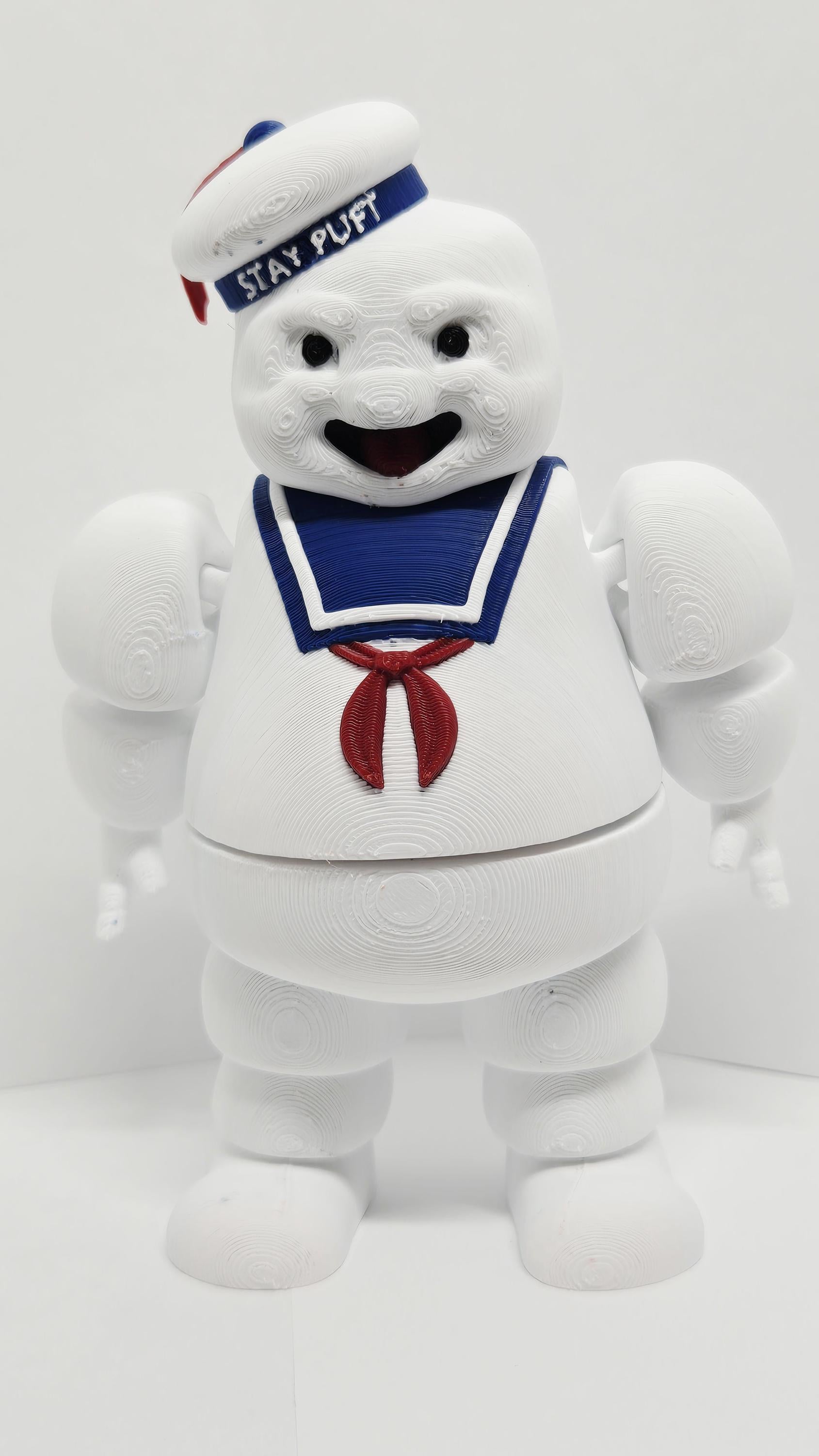 Three-quarter right side view of the flexible Stay Puft figure showcasing the sailor hat, neckerchief, and limb joints