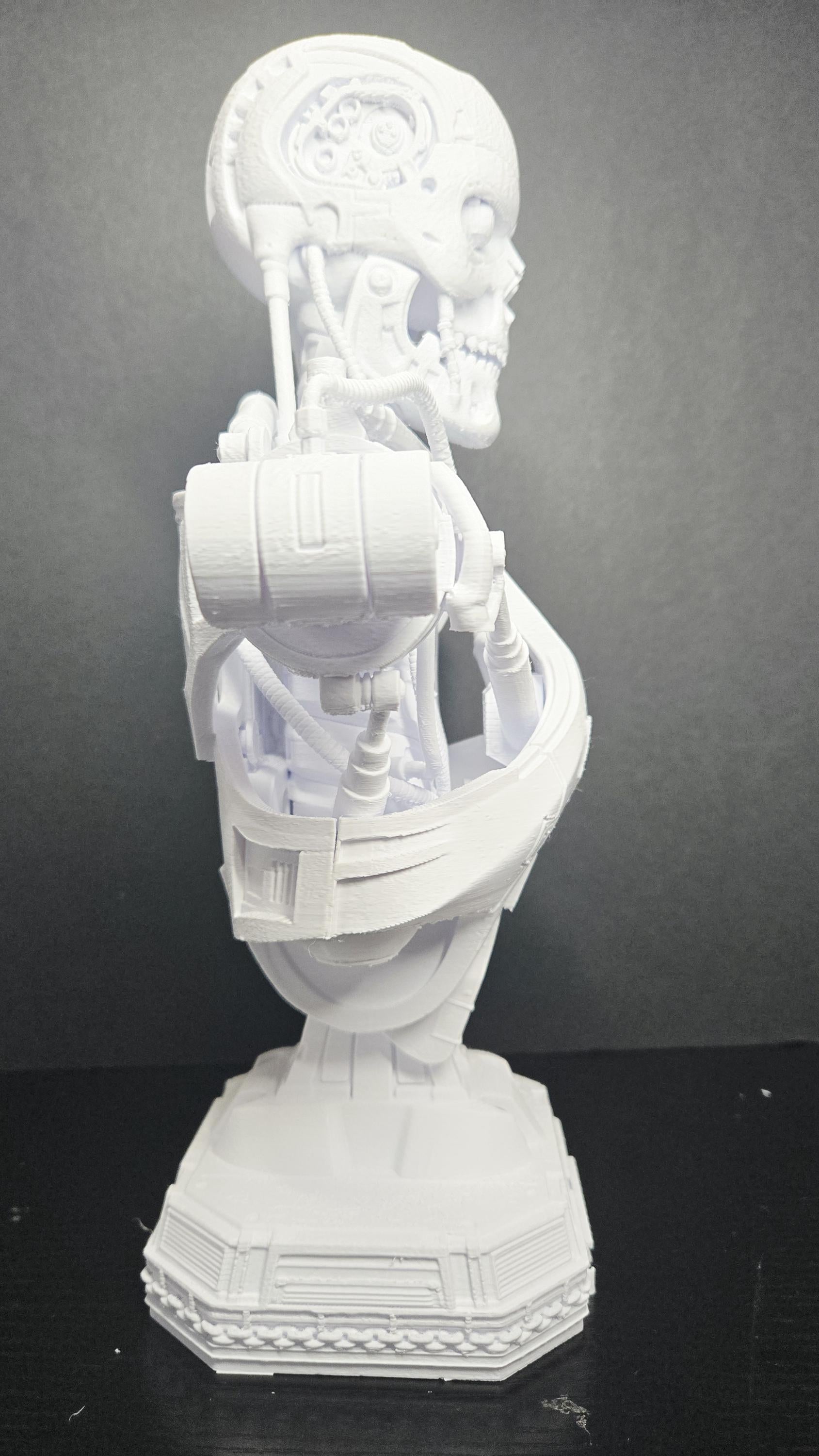 Side profile view of the T-800 Terminator bust highlighting the intricate mechanical jaw and skull details