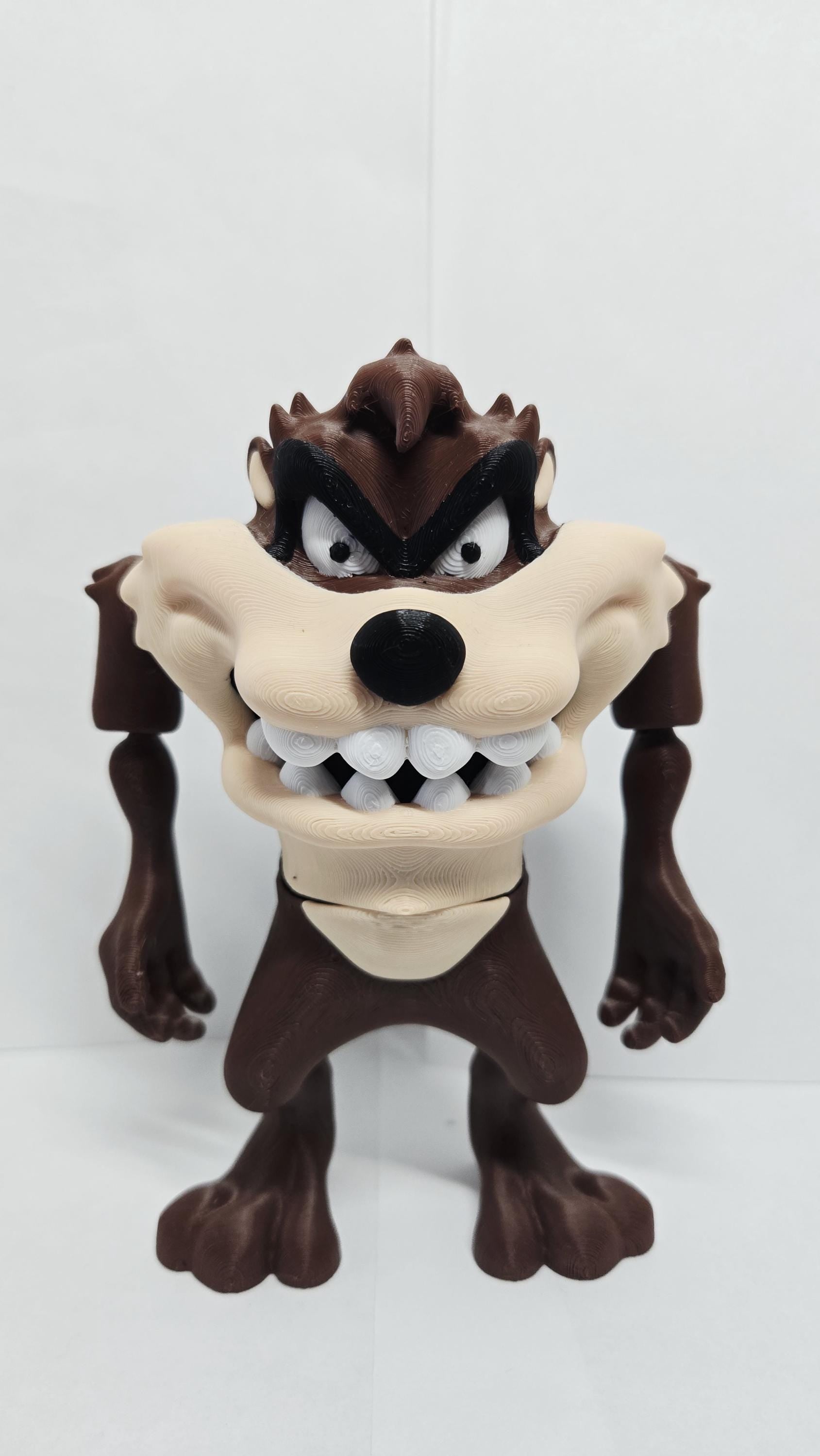 Close-up front shot highlighting the full-color facial details and eyes of the 3D printed Tasmanian Devil figure