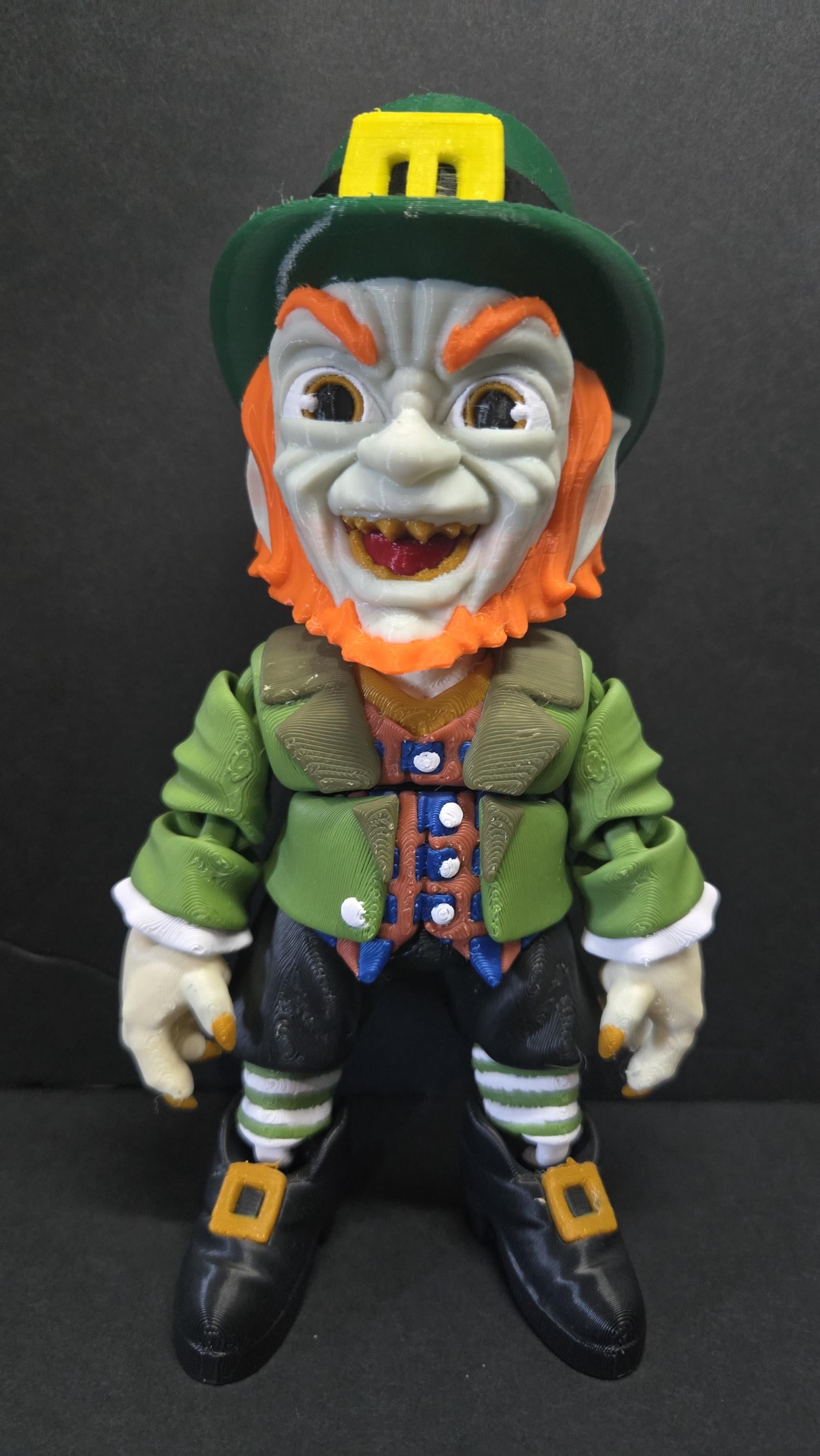 Straight front view focusing on the detailed sinister face, green top hat, and ginger hair of the flexible Leprechaun figure