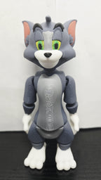 Straight front view of the jointed Tom Cat figure to demonstrate the multi-color face and chest print details