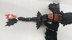 Top-down view of the flexible Toothless dragon figure showcasing wing spread and tail articulation