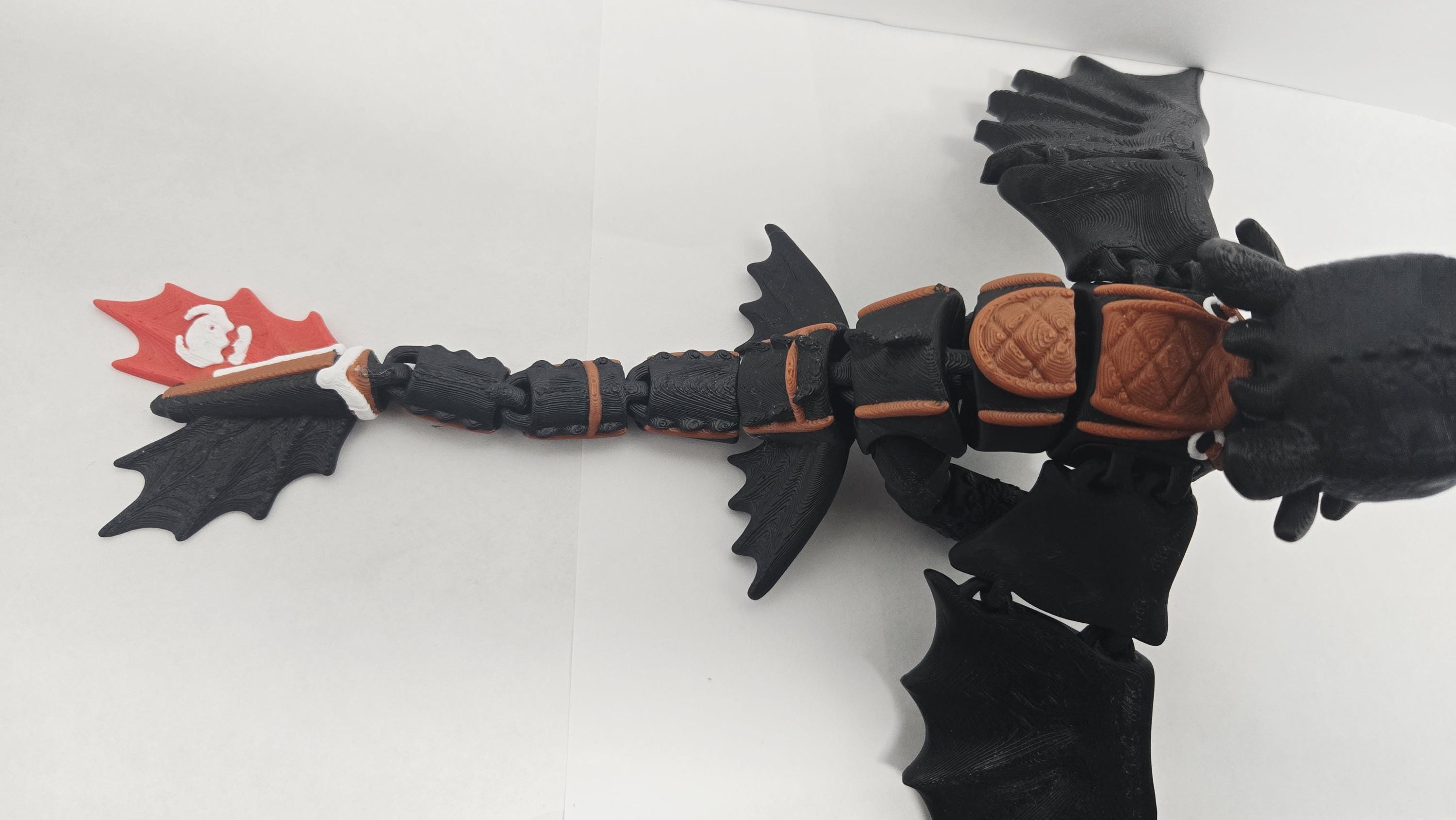 Top-down view of the flexible Toothless dragon figure showcasing wing spread and tail articulation