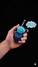 Full-scale 3D printed underwater cartoon walkie-talkie prop with functional clicker being held in a hand