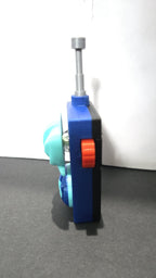 Side profile view of the 3D printed walkie-talkie prop highlighting the red trigger button and antenna detail